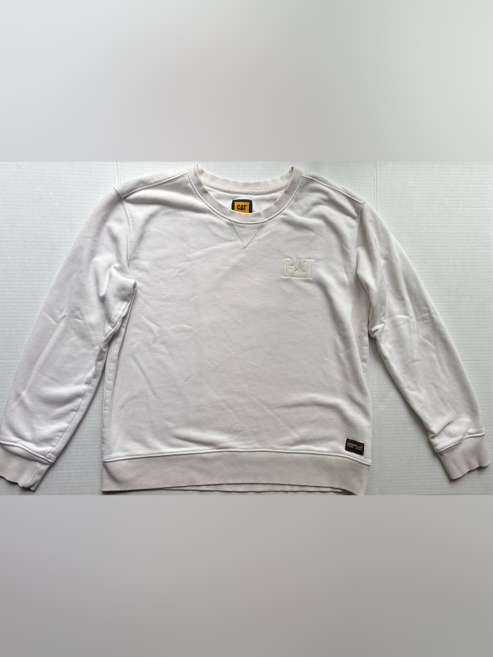Cat caterpillar beige cream white logo crewneck sweater workwear utility winter